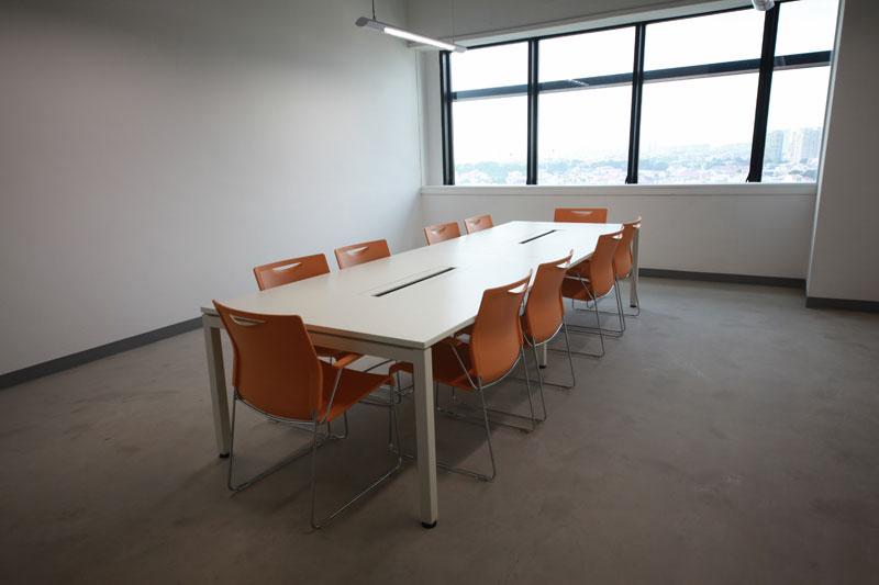 Conference table with orange chairs