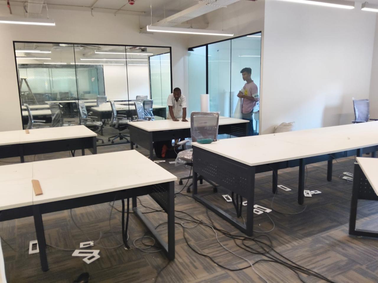 Open plan workstation installation in progress