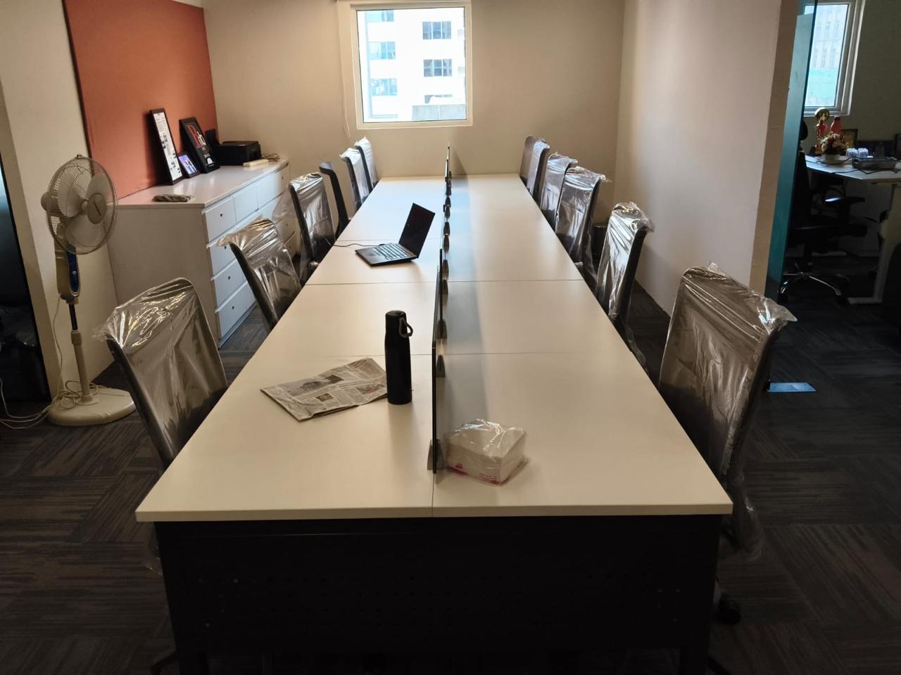 Conference table with chairs ready for handover
