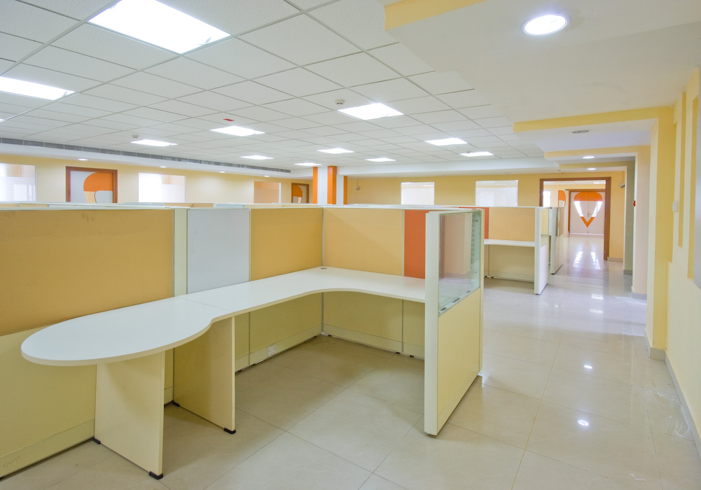 Dark navy cluster workstation panels with full privacy screens